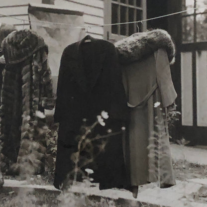 Press Photo Photograph Woman with Winter Coats on Clothesline keystone Underwood
