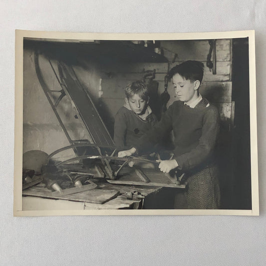 Press Photo Photograph Kids Sharpening Skates and Sled Keystone Underwood Photo