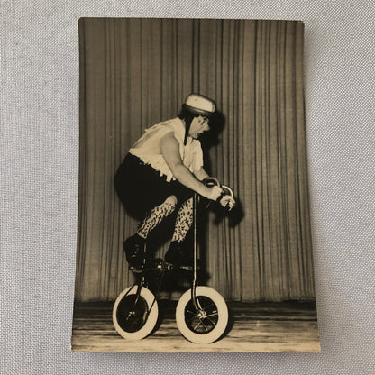 Circus Clown Performer on Mini Bicycle Bike Photograph Photo Berlin Germany