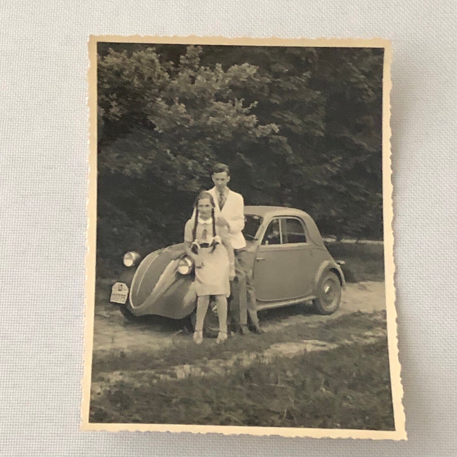 Vintage Photo Photograph Young Couple Man Woman with Small Car Tag AL22SM2