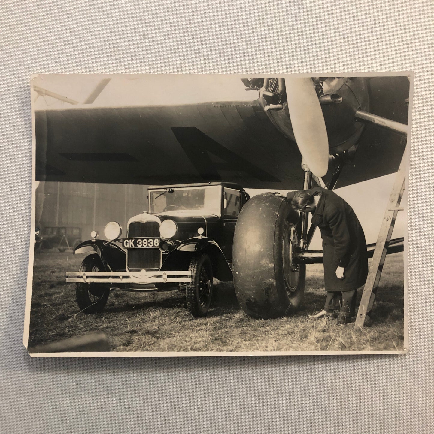 Hannibal Aircraft Landing Wheel with Ford Car Press Photo Photograph Airplane