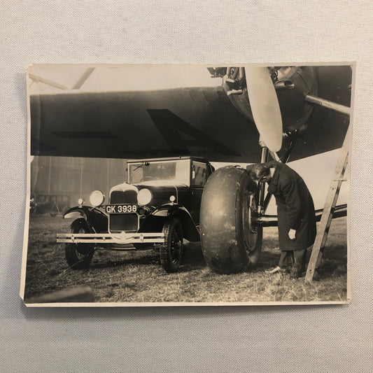 Hannibal Aircraft Landing Wheel with Ford Car Press Photo Photograph Airplane